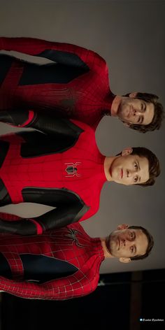 two men in spider - man suits standing next to each other with their hands on their hips