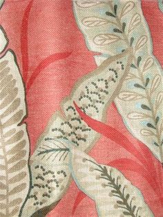 a close up of a red and white curtain with some leaves on it's side