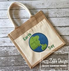 the earth day bag is sitting on top of a wooden table