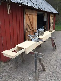 a bench made out of wood with a circular sawhorse on it's end