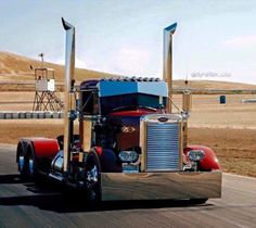 a large semi truck driving down the road