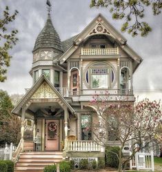 a victorian style house with an ornate porch