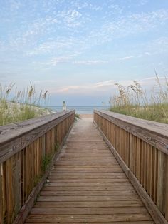 a wooden walkway leading to the beach