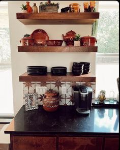 a kitchen counter with pots and pans on it