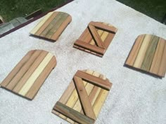 four pieces of wood are laid out on the ground