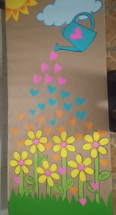 a paper bag with flowers and watering can painted on it in the shape of hearts