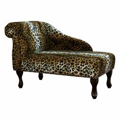 a leopard print chair with wooden legs and foot rest on an isolated white background photo