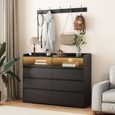 a living room with a couch, chair and coat rack