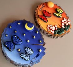 two cakes decorated to look like butterflies and moon