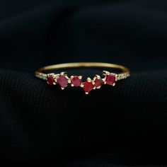 Express your undying love for her by presenting this adorable Semi Eternity Ring and make her feel special and loved.  This Minimal Ring is decorated with Round and Princess Cut Ruby of AAA Quality in Prong Setting, while sparkling Diamond gemstones are studded over half of the shank.  Near 1/2 carat Ruby and Diamond Ring will surely be the right choice for her, something she would never forget to wear.  Rosec Jewels has a vast collection of Ruby Rings for Women at affordable prices in various c Small Simple Wedding, Dainty Ruby Ring, Ring With Ruby, Minimal Ring, Promise Rings For Her, Garnet Jewelry, Half Eternity Ring, Signature Jewelry, 18k Yellow Gold Ring