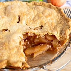 an apple pie is cut in half and ready to be eaten