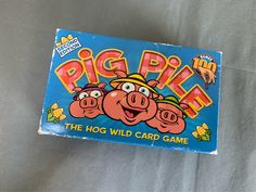 a card game called pig pie the hog wild card game on a gray sheet with an image of three pigs