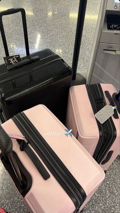 three pieces of luggage sitting on top of a counter next to each other at an airport