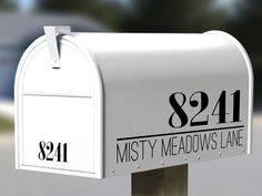 a white mailbox with the number 821 on it's front and side