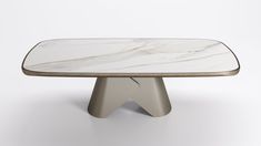 a table with a white marble top and metal legs on an isolated surface, in front of a plain background