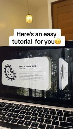 an open laptop computer sitting on top of a table with text reading here's an easy tutor for you