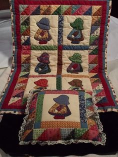 a quilted chair with two pillows on it