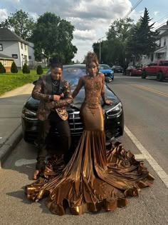 Black And Brown Prom Couple, Gold Dress On Black Women, Long Train Prom Dress, Brown And Gold Prom Dress Couple, Prom Dresses Black Women Plus Size, Hood Prom 2023, Prom Dresses On Black Women, Dark Skin Prom Dress, Prom Dresses Inspo Aesthetic