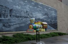 a train painted on the side of a building