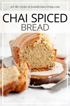 a loaf of chai spiced bread on top of a plate with a slice cut out