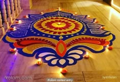 a decorated floor with candles on it and an intricately designed design in the center