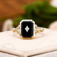 "❤Jewelry Details -Gold Type : 18k two tone gold / 14k two tone gold / 10k two tone gold / Platinum /925 sterling silver two gold plated (Choose One in Material Option) Center Stone: Natural Black Onyx 8*11mm, Approximately 2.8ct Cut: Emerald Cut / 3EX Stone Type: Diamond,0.01ctw Color: G-H Clarity: SI1 Cut: Round Cut / 3EX Band Width: Approximately 1.7mm SKU: YR1111 ❤The link for the same style necklace is https://www.etsy.com/listing/919600248/vintage-black-onyx-pendant-necklace-pave?ref=shop_home_active_1&frs=1 ❤The link for the same style earrings is https://www.etsy.com/listing/1011240940/emerald-cut-natural-black-onyx-earrings?ref=shop_home_active_1&frs=1 ~*-*~Purchase Guarantee: - All our jewelry is handmade, and each process is refined. - 14 Day Refund Guarantee. - All our products Onyx Vintage Ring, Black Onyx Diamond Ring, Onyx And Diamond Ring, Black Stone Engagement Ring, Vintage Onyx Ring, Art Deco Flower, Onyx Engagement Ring, Plus Size Rings, Black Onyx Earrings