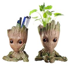 two little groote planters with pens in their heads and the caption says, a multi purpose can be used as a pen holder, can also be used to make flower pots