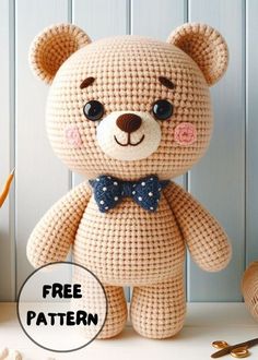 a crocheted teddy bear with a bow tie