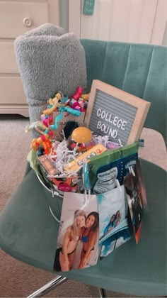 a chair that has some pictures and other items in it on top of the chair