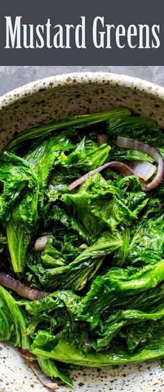 a white bowl filled with greens and onions