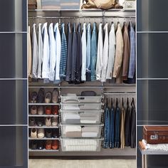 an organized closet with clothes and shoes