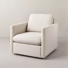 a white chair sitting on top of a gray floor