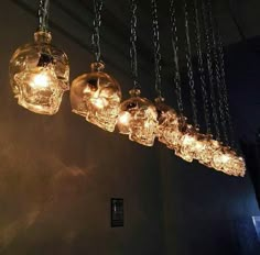 some lights that are hanging from chains