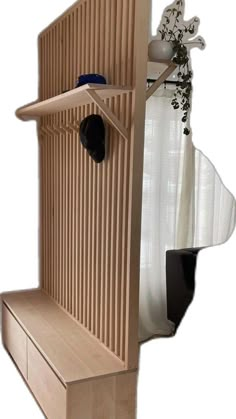 a wooden birdhouse with its door open