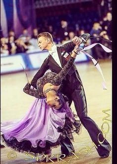 a man and woman are performing on the ice