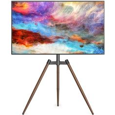 an abstract painting is displayed on a tripod with two wooden legs and a white background