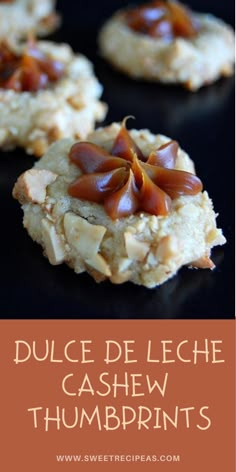 some cookies with nuts on top and the words dulce leche cashew thumbprints