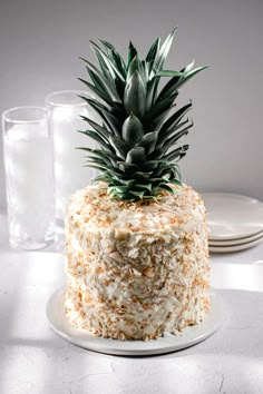 a pineapple on top of a white cake