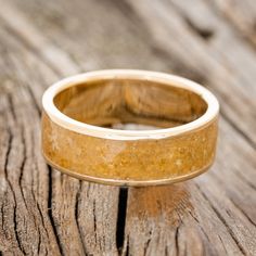 a wedding ring sitting on top of a wooden table