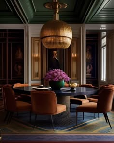 a dining room table with chairs and a chandelier hanging from it's ceiling