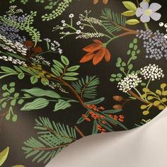 an image of a wallpaper with flowers and leaves on it's black background