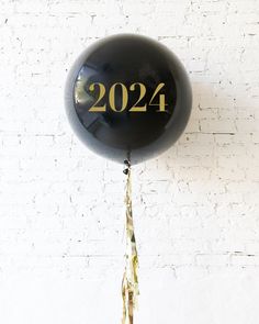 a black balloon with the number twenty four printed on it