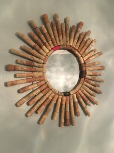 a circular mirror made out of wine corks