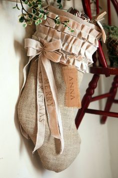 a burlap sack hanging on the wall with a ribbon around it that says i love you