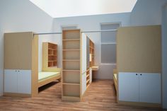 an empty room with shelves and beds in it