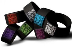 several different colored bracelets with qr code designs on them, all stacked together