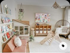 a child's playroom with toys, bookshelves and other items in it