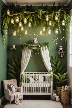 a baby's room decorated in green and white with lights hanging from the ceiling