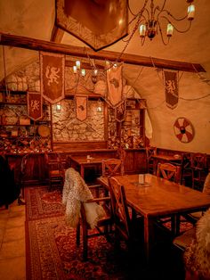 an old fashioned dining room with wooden tables and chairs