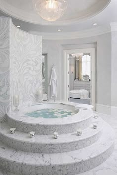 a white bathroom with a large jacuzzi tub